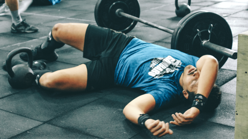 An exhausted man lying on the floor