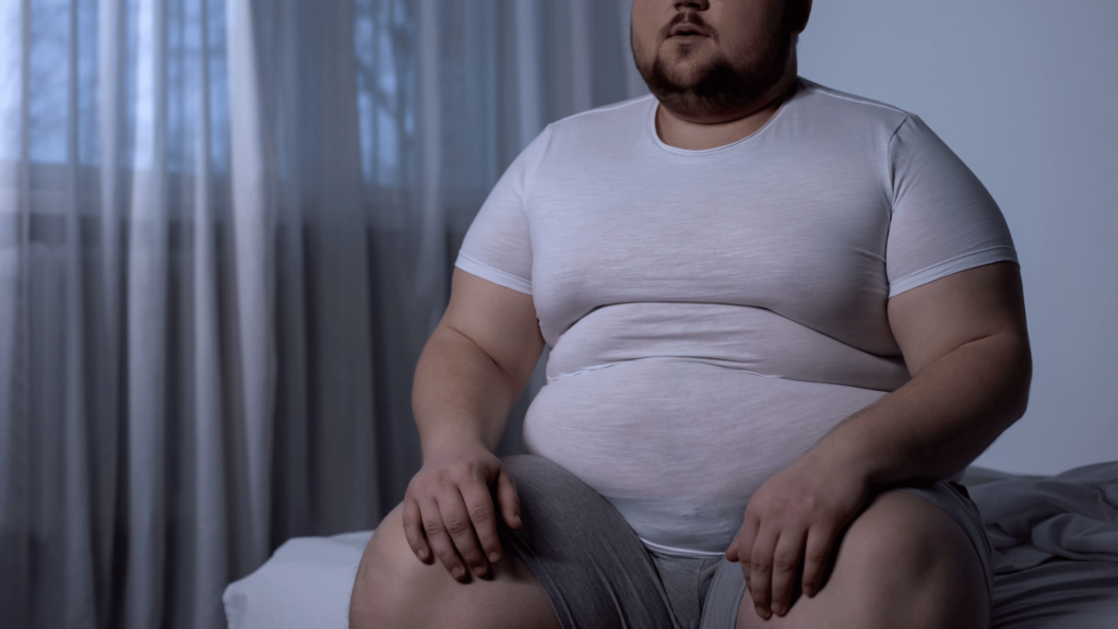 Man with fat accumulation in the abdomen