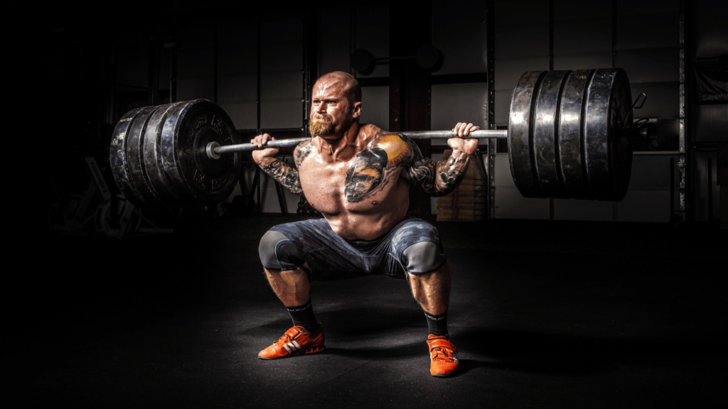 man doing squats with a lot of weight